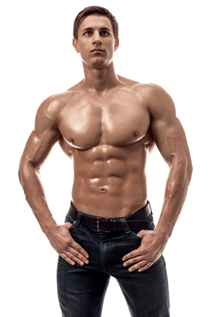 Muscular handsome young man with naked torso. Isolated on white background.の写真素材