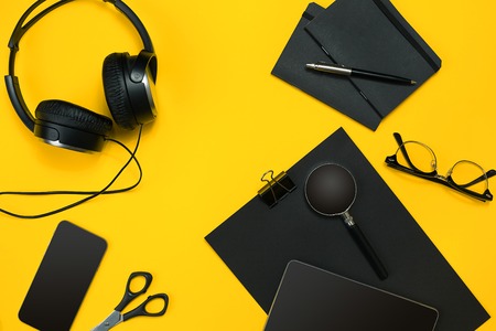 Workplace with office items and business elements on a desk. Con