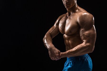 Part of a mans body on a dark background with copyspaceの写真素材