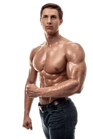Muscular handsome young man with naked torso. Isolated on white background.の写真素材