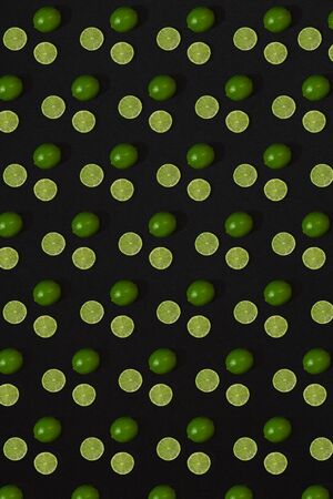 Lime pattern on black background. Minimal flat lay concept. Printの写真素材