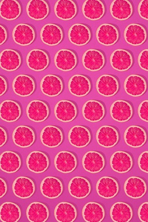 Grapefruit pattern on pink background. Minimal flat lay concept. Printの写真素材