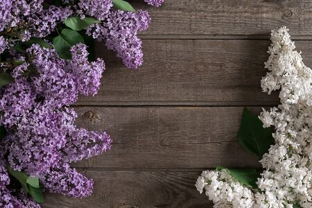 Lilac blossom on rustic wooden background with empty space for greeting message. Top viewの写真素材