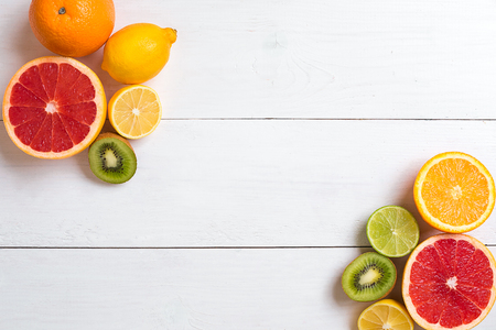 Various citrus fruits on the table. Top viewの写真素材