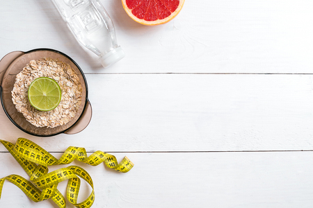Healthy food with muesli, water and grapefruit. Top view.の写真素材