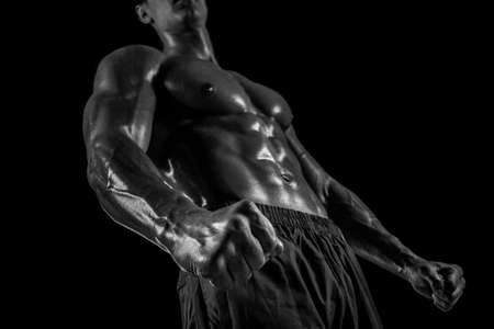 Part of a mans body on a dark background with copyspaceの写真素材