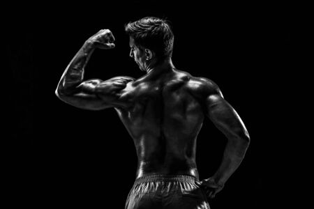 Strong Athletic Man Fitness Model posing back muscles, triceps oの写真素材