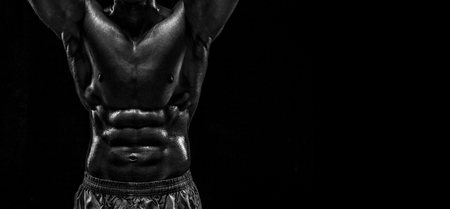 Part of a mans body on a dark background with copyspace