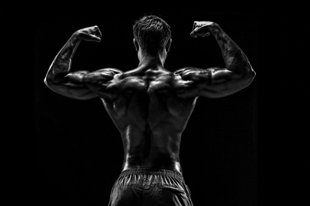 Strong Athletic Man Fitness Model posing back muscles, triceps oの写真素材