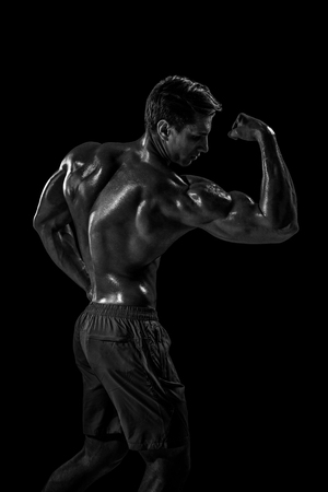 Strong Athletic Man Fitness Model posing back muscles, triceps oの写真素材
