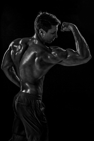 Strong Athletic Man Fitness Model posing back muscles, triceps oの写真素材