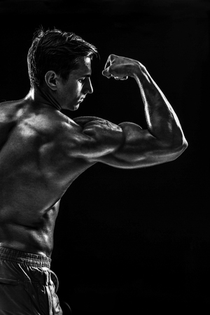 Strong Athletic Man Fitness Model posing back muscles, triceps oの写真素材