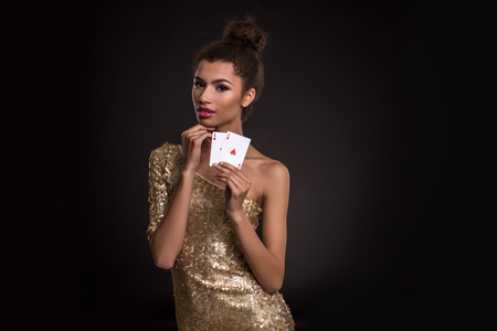 Pretty african girl shows two aces in casino poker and winの写真素材