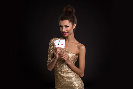 Pretty african girl shows two aces in casino poker and winの写真素材