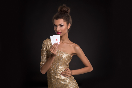 Pretty african girl shows two aces in casino poker and winの写真素材
