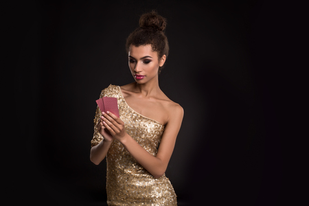 Pretty african girl shows two cards in casino poker and winの写真素材