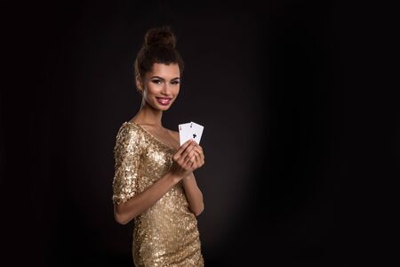 Pretty african girl shows two aces in casino poker and winの写真素材