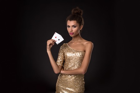 Pretty african girl shows two aces in casino poker and winの写真素材