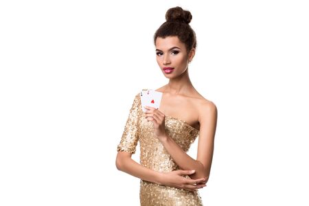 Pretty african girl shows two aces in casino poker and winの写真素材