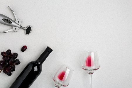 Bottle of red wine with glasses on white background top view mock-upの写真素材
