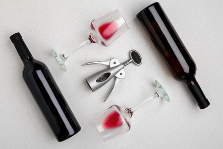 Red and white wine bottles and glasses, top viewの写真素材