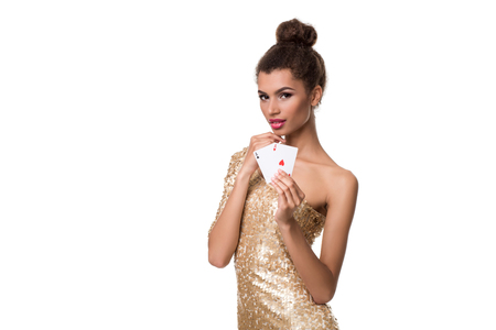 Beautiful young woman holding two ace of cards in her hand isolated on whiteの写真素材
