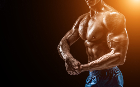 Part of a mans body on a dark background with copyspaceの写真素材