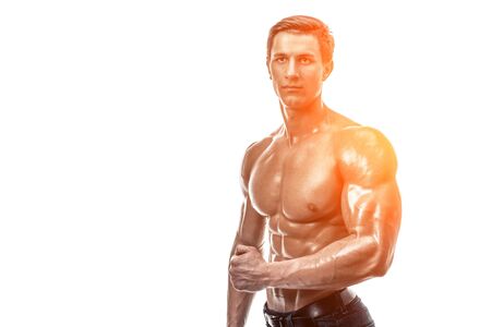 Muscular handsome young man with naked torso. Isolated on whiteの写真素材