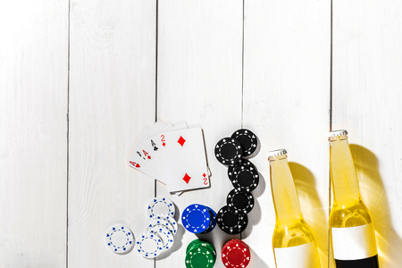 Poker. Set to playing poker with cards and chips on white wooden table, top viewの写真素材
