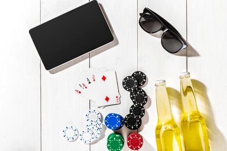 Poker. Set to playing poker with cards and chips on white wooden table, top viewの写真素材