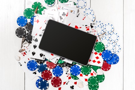 Post blog social media poker. Banner template layout mockup for online casino. Wooden white table, top view on workplace.の写真素材