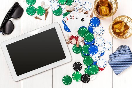 Post blog social media poker. Banner template layout mockup for online casino. Wooden white table, top view on workplace.の写真素材