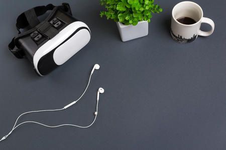 Virtual reality glasses and headphones on a gray background. Top viewの写真素材