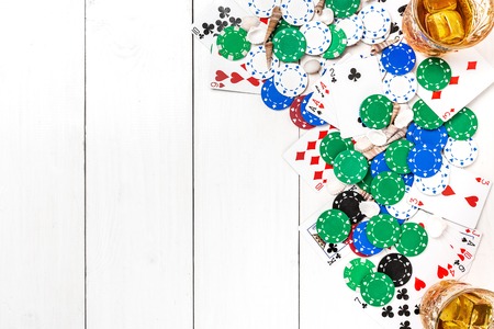 Gambling. Poker chips and cards on wooden table. Top view. Copyspace. Pokerの写真素材