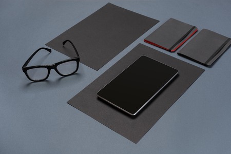Modern mock up flat lay of notebook and stationery on gray background.の写真素材