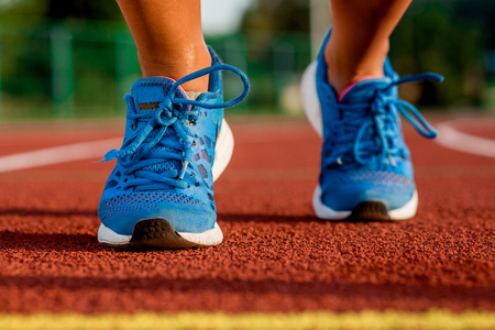 Close-up of womans legs on start before jogging