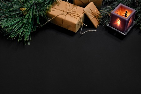 Christmas. Xmas toys and spruce branch on black background top view. Space for textの写真素材