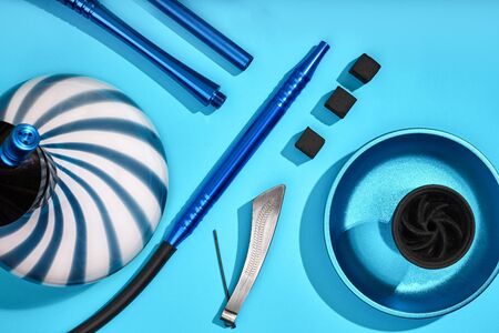 Top view of Hookah parts on light blue background. Still life. Copy space. Flat lay