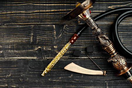 Dismantled parts of hookah on wooden background.の写真素材