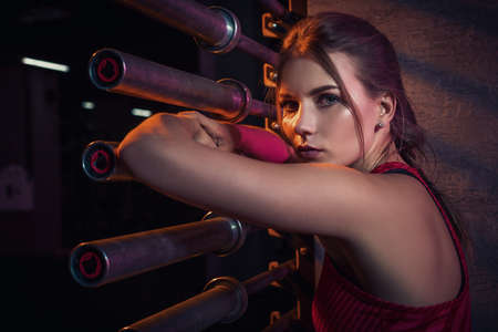 Young beautiful woman posing in a gym outfit.の写真素材