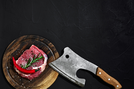 Raw beef steak dry aging on wooden cutting board. Copy spaceの写真素材