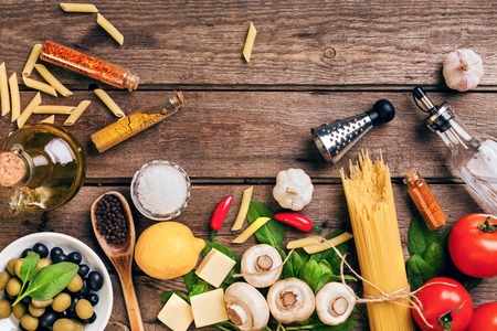 Italian food ingredients for the preparation pasta on wooden background. Top view. Copy space. Still lifa. Flat layの写真素材