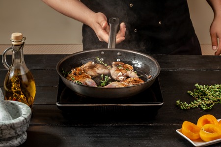Chef cook the quail into the frying panの写真素材