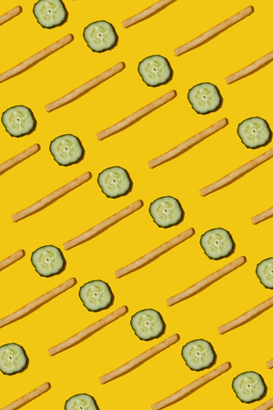 Heap of french fries on yellow background, top viewの写真素材