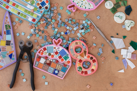 Workplace of mosaic maker: material and tools on wooden tableの写真素材