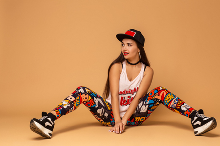 Modern style dancer posing on studio background. Hip hop, jazz funk, dancehallの写真素材