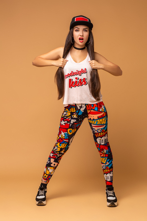 Modern style dancer posing on studio background. Hip hop, jazz funk, dancehallの写真素材