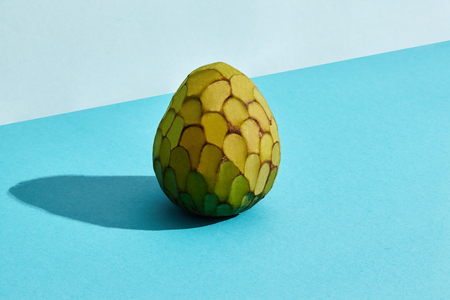 Close up high quality image of whole sugar-apple, fruit of Annona squamosa cherimoya, fruit composition on blue pastelの写真素材