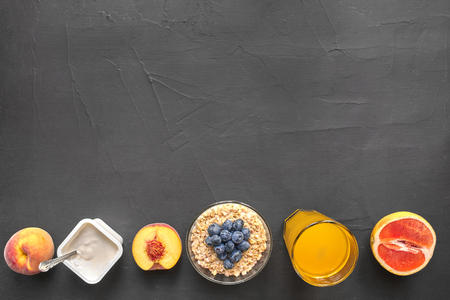 Top view of healthy and delicious breakfast on a black background with copyspace.の写真素材