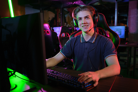 Cyber sport. Team play. Professional cybersport player training or playing online game on his PCの写真素材